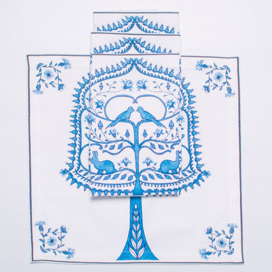 Decorative napkin with blue tree design on a white background